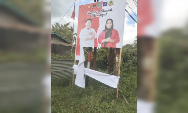 Baliho pasangan bakal calon wali kota dan Wakil Wali Kota Kendari, Yudhianto Mahardika dan Nirna Lachmuddin dirusak orang tak dikenal pada Senin (16/9/2024). Foto/R. Hafid/bentaratimur.id